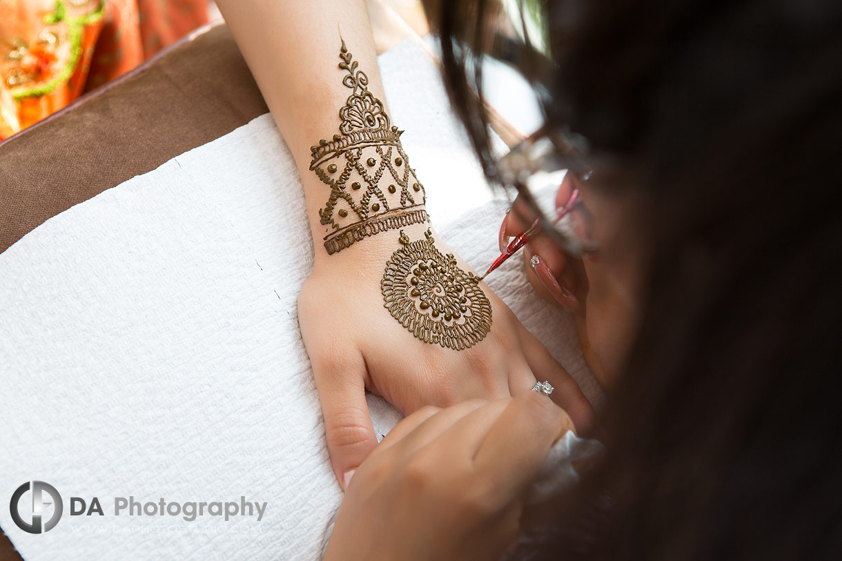 Henna artist during pre-wedding ceremony