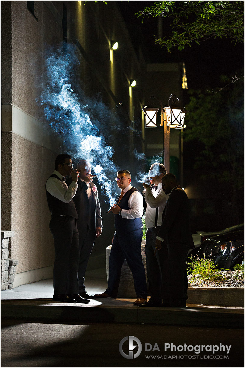 Groomsman's Smoking cigars at Bellagio Wedding