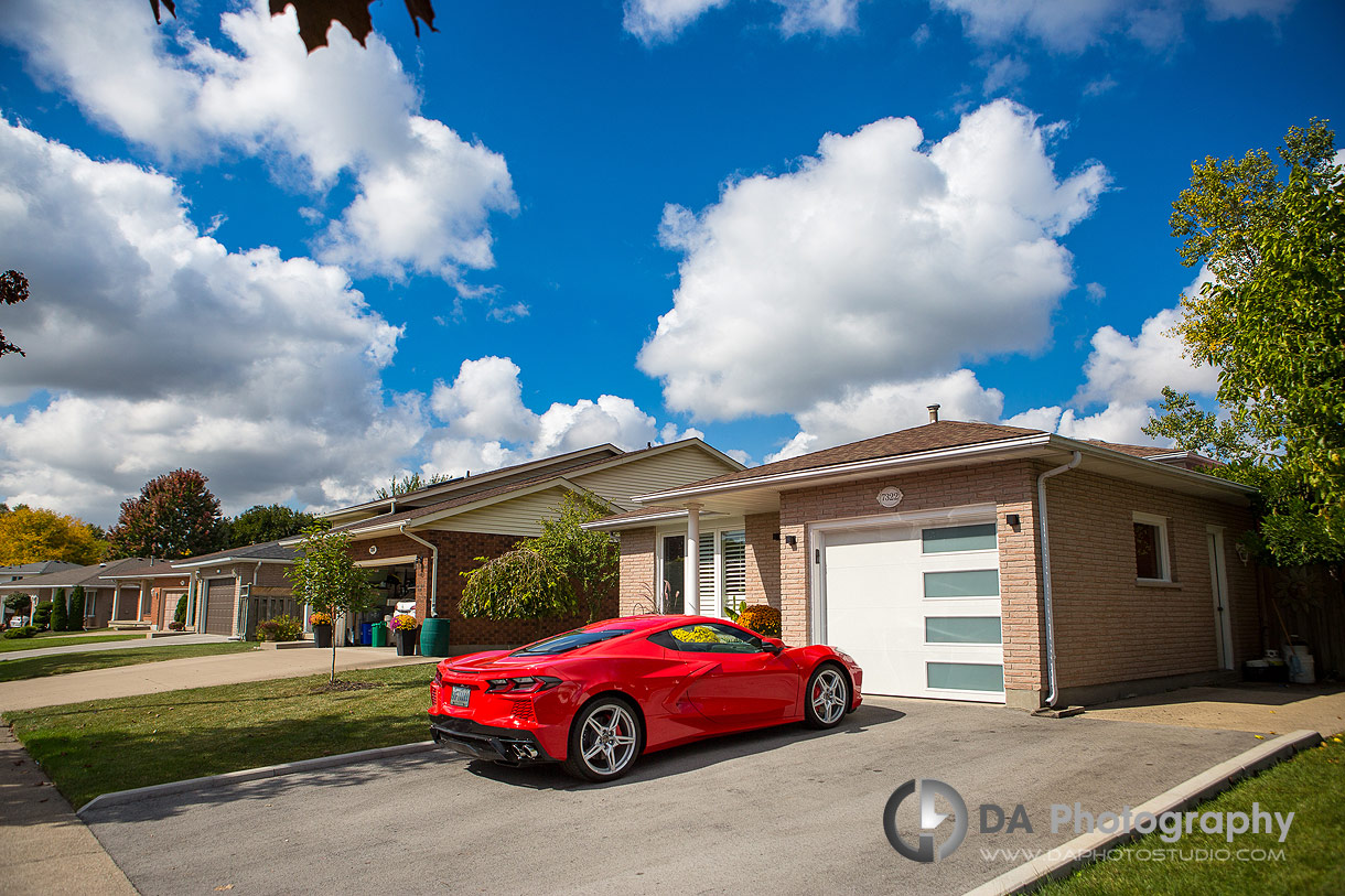 Photo od a Red Corvette park in a driveway