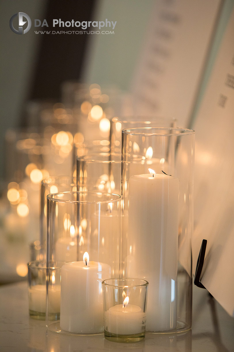 Candles in glass holders during a wedding day