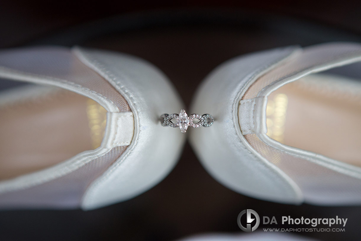 Engagement ring between brides shoes