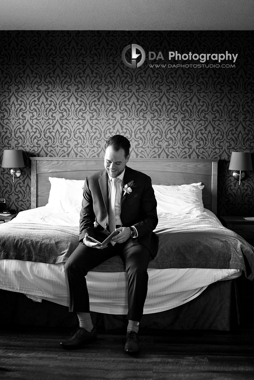 Groom reads a letter at Cambridge Hotel