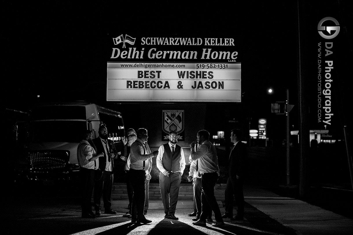 Groom with his groomsman's smoking cigars