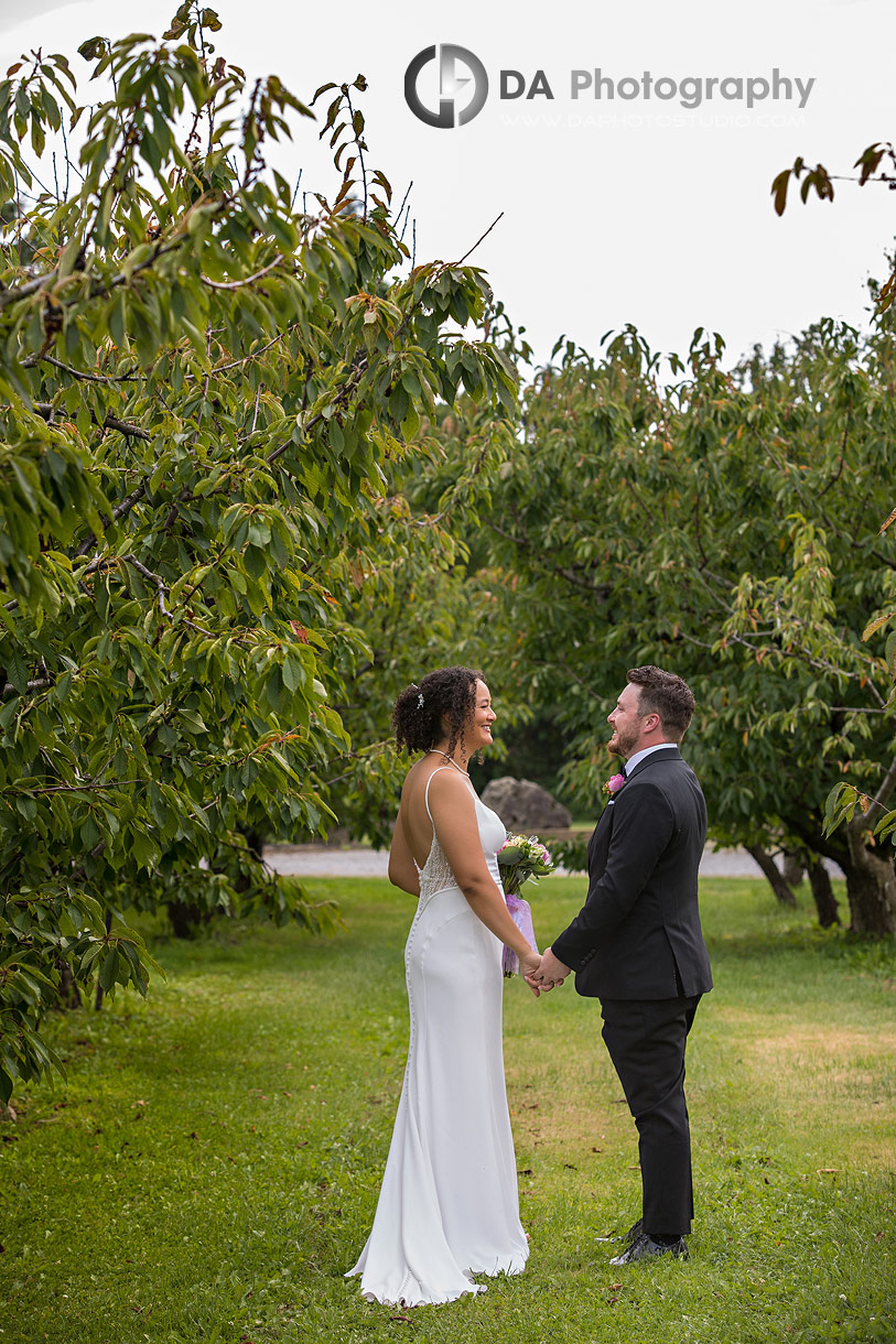 Bride and Groom Fist Look Photo at Niagara's Peach Orchard Wedding