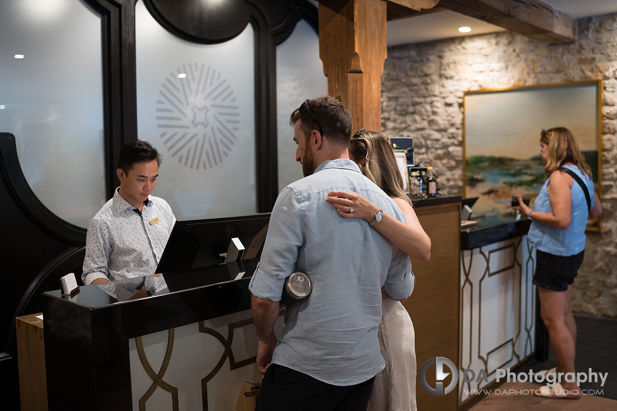 Photo of a Couple checking in at a hotel