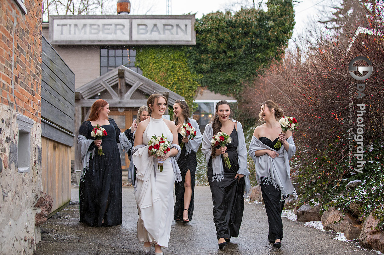 Bride with her Bridesmaids on a winter wedding at St. Jacobs 