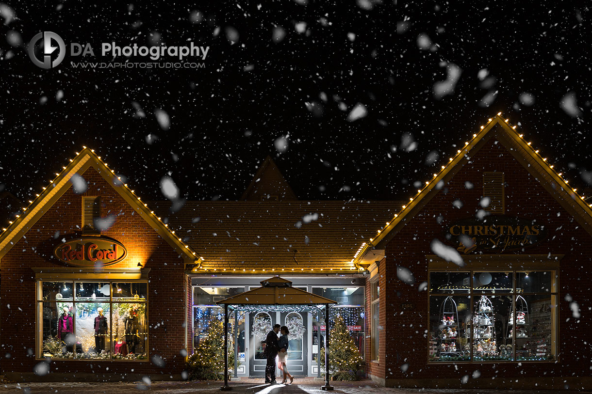 Nigh time photo of bride and groom during snowfall in St. Jacobs