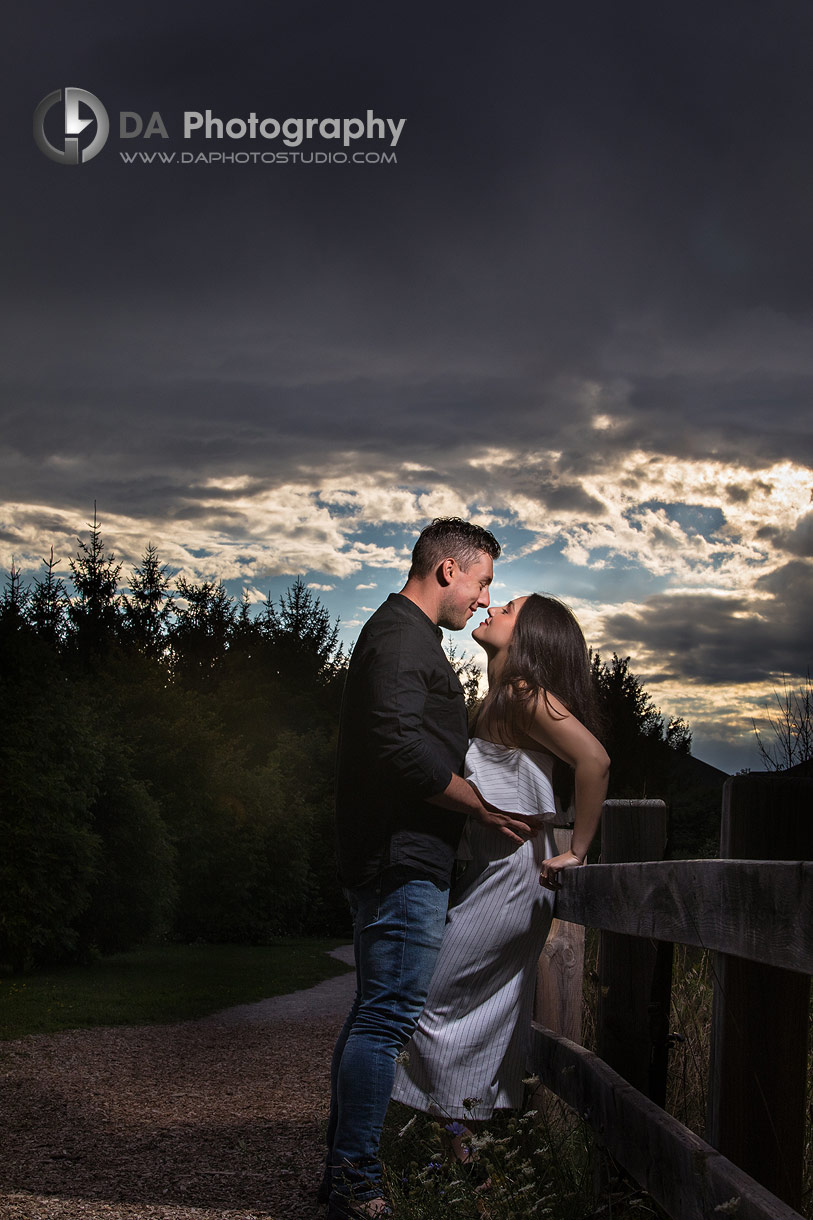 Photo of a dramatic sky and couple in love