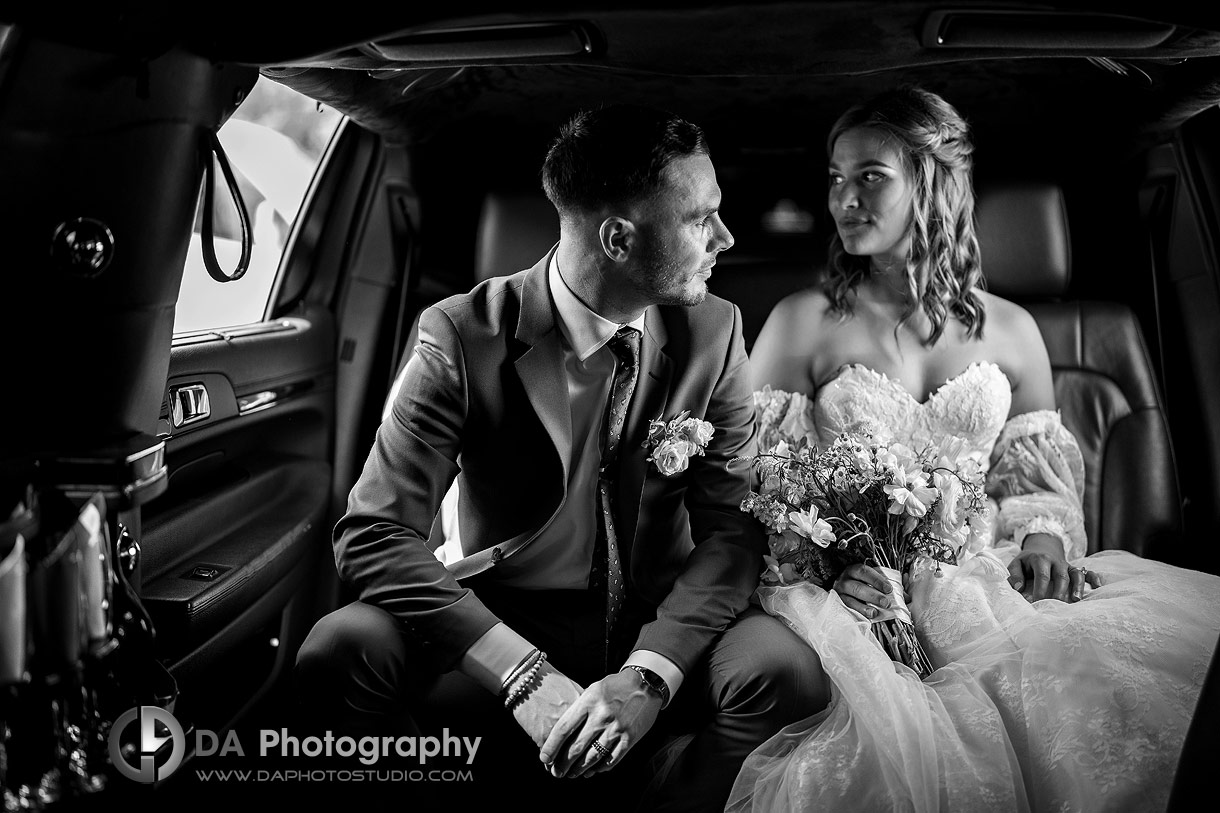 Photo Bride and Groom at Slit Barn wedding in the limo