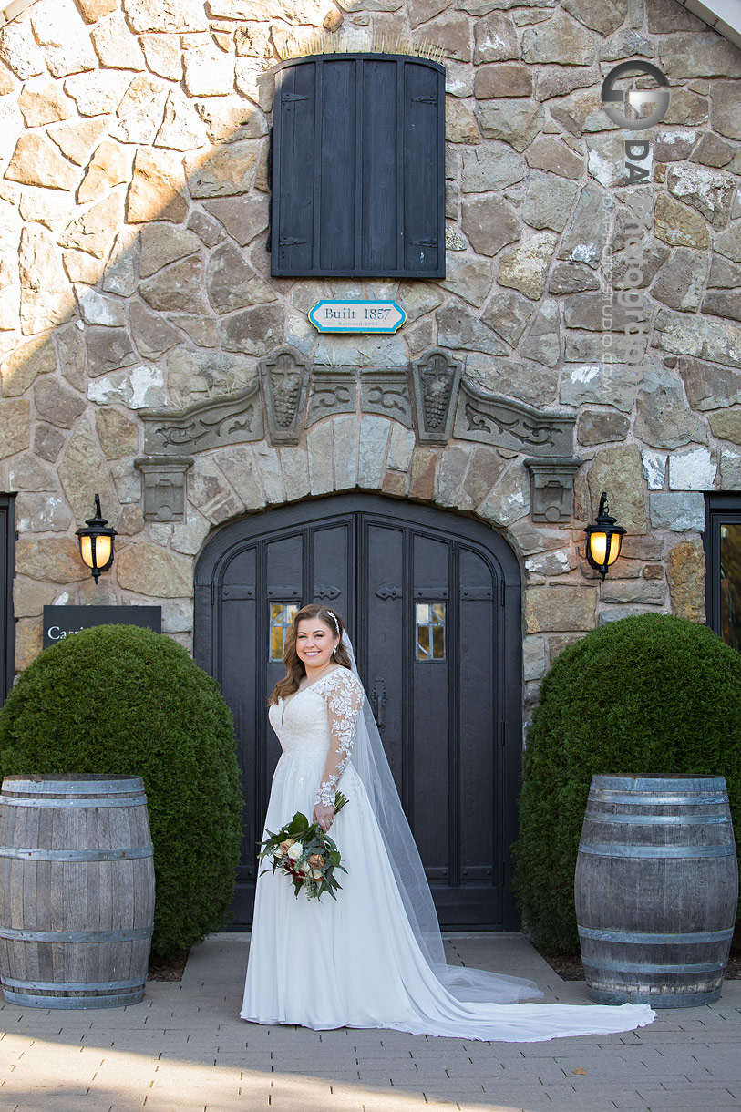 Bride in front of Carriage House at Vineland Estates Winery