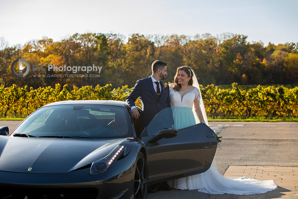 Photo of a wedding couple with a Ferrari