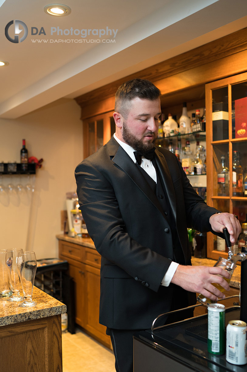 Groom getting draft beer in his basement