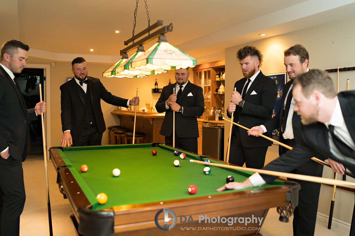 Photo of Groomsman's playing pool