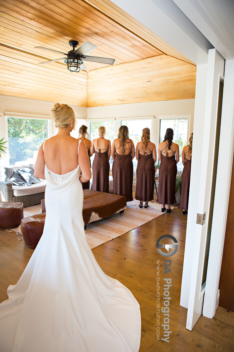 Photo of Bride's dress reveal with her bridesmaids