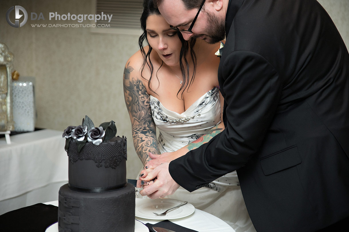 Bride and Groom cut black cake