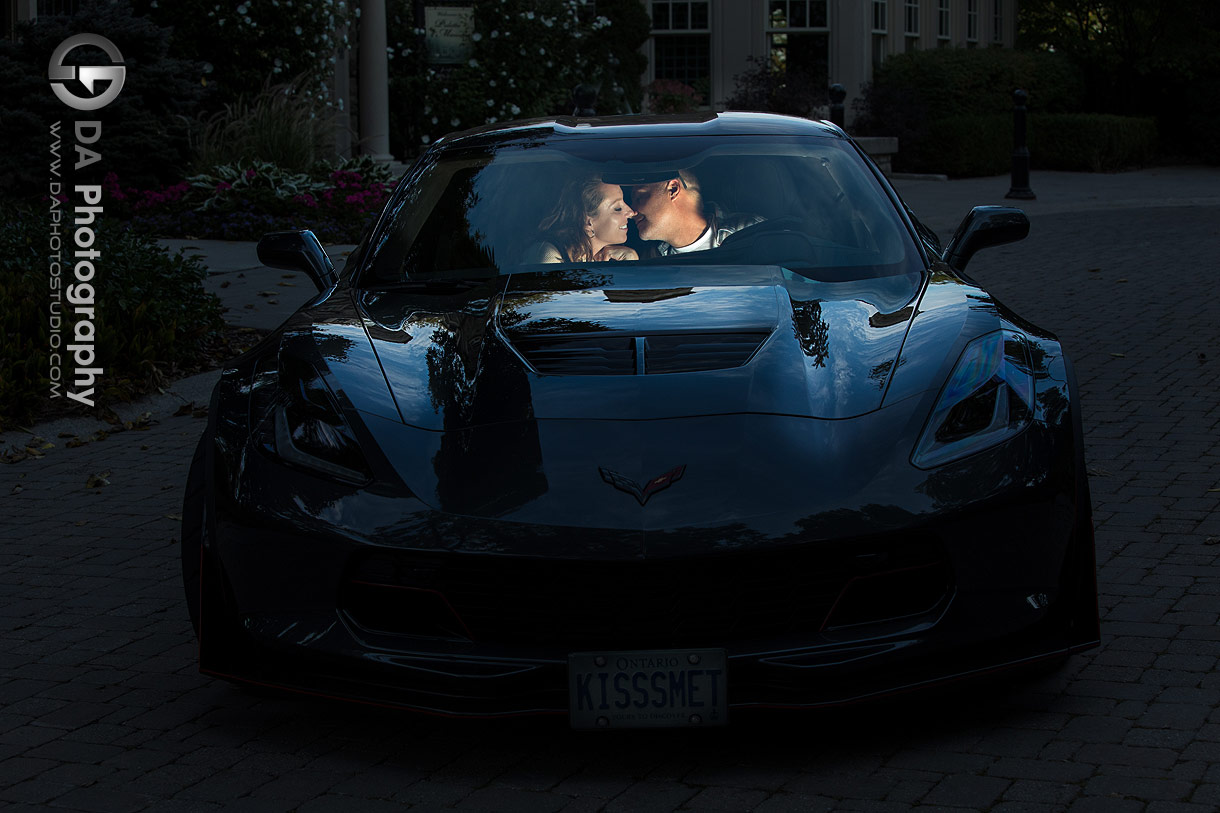 Engaged couple in their Corvette in the night Engaged couple in their Corvette in the night