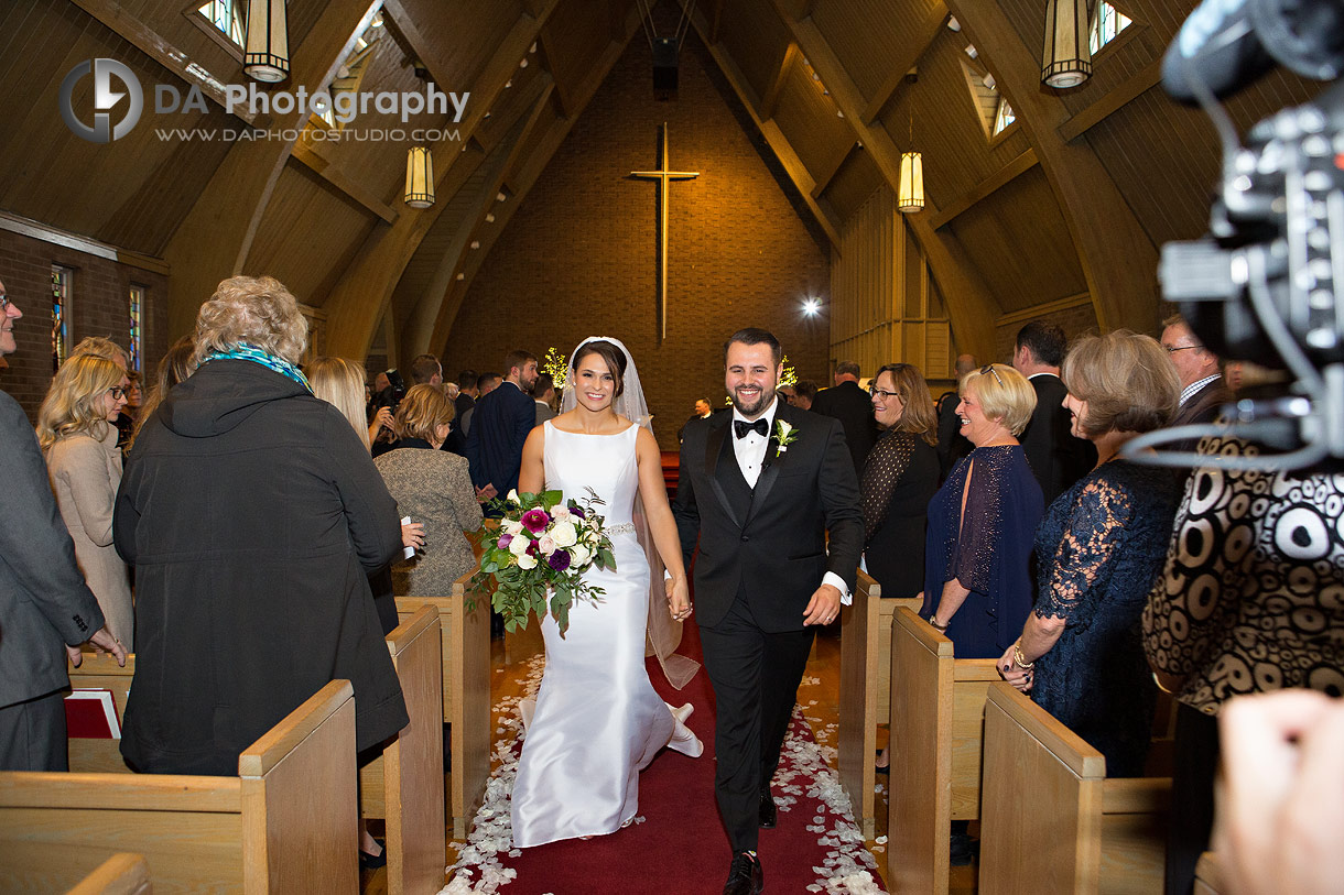Photo of a bride and groom recessional walk at The Ryerson United Church in Ancaster Photo of a bride and groom recessional walk at The Ryerson United Church in Ancaster