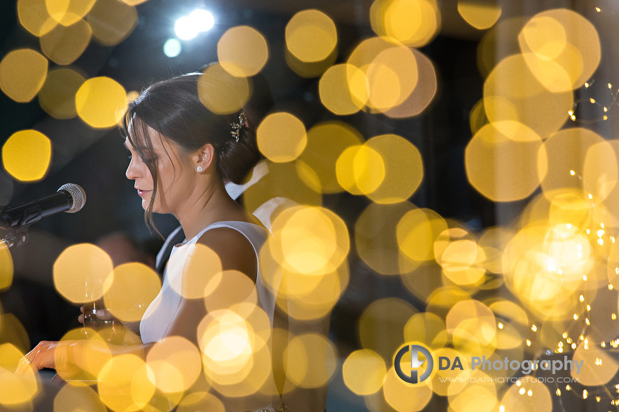 Photo of a Brides speech at Hamilton Golf and Country Club through twinkling lights Photo of a Brides speech at Hamilton Golf and Country Club through twinkling lights
