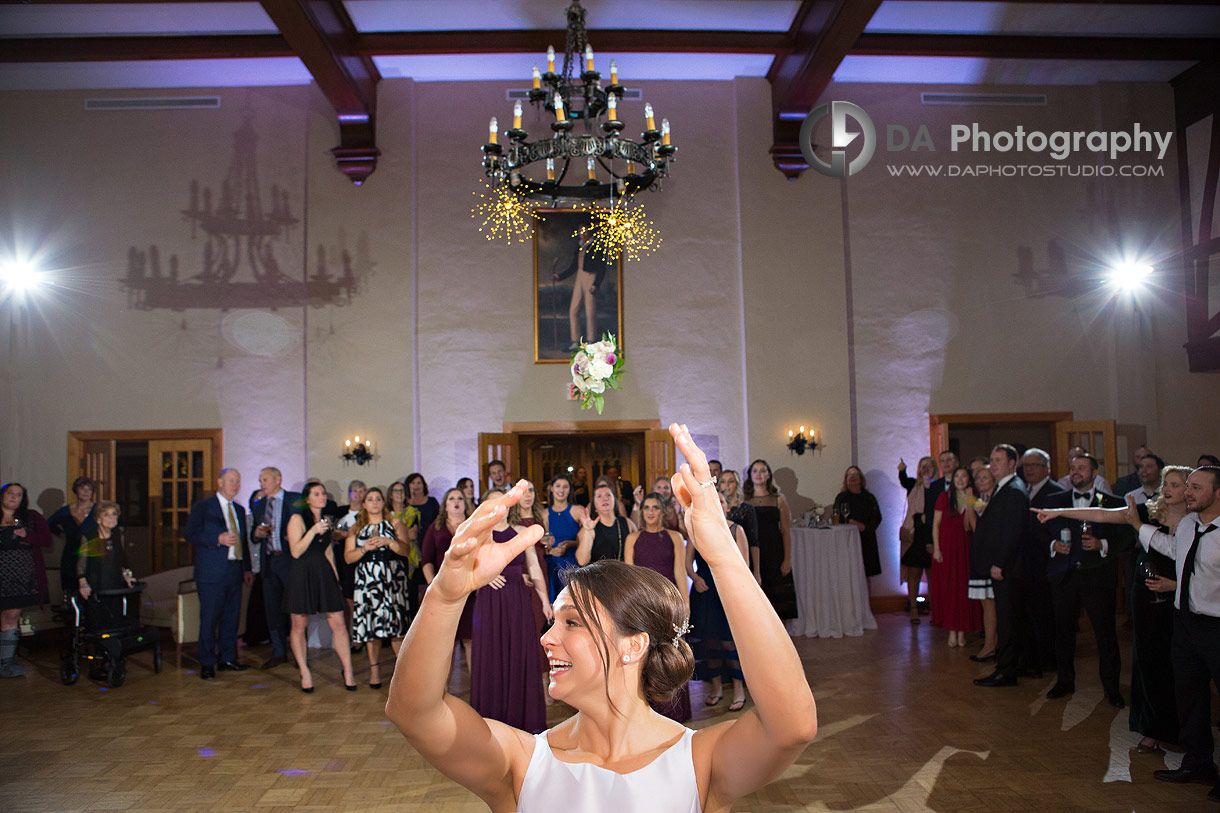 Photo of a bride throwing her bouquet at Hamilton Golf and Country Club Wedding Photo of a bride throwing her bouquet at Hamilton Golf and Country Club Wedding