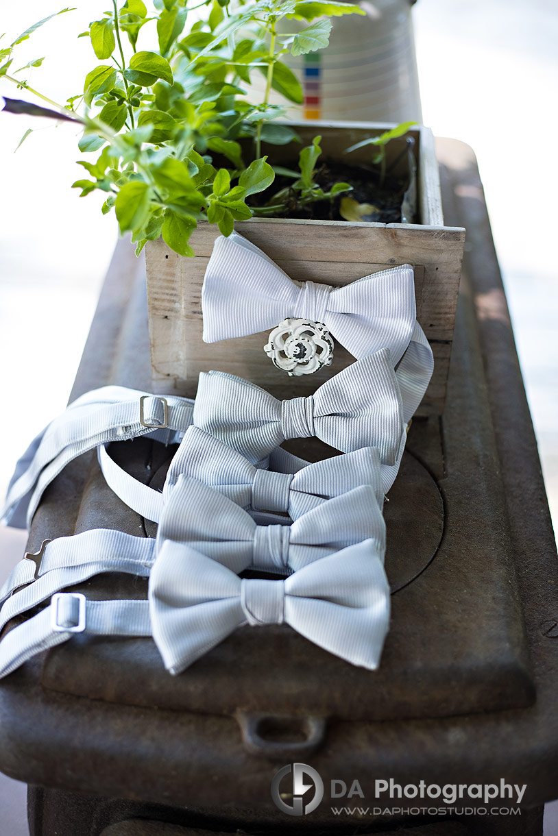 Close up photos of groomsman's bow ties