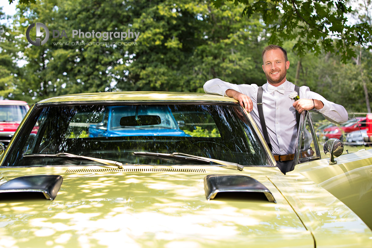 Groom next to his vintage car photo
