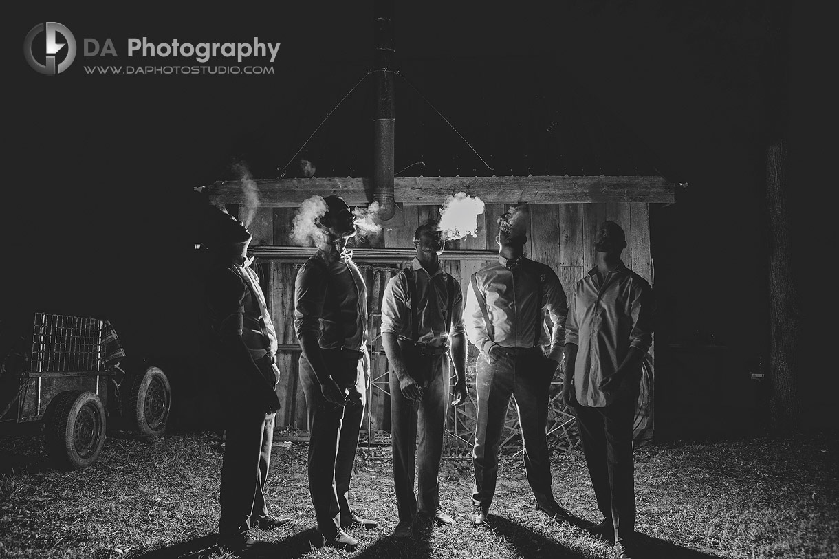 Farm Wedding Photo of groomsman's smoking cigars in Brantford