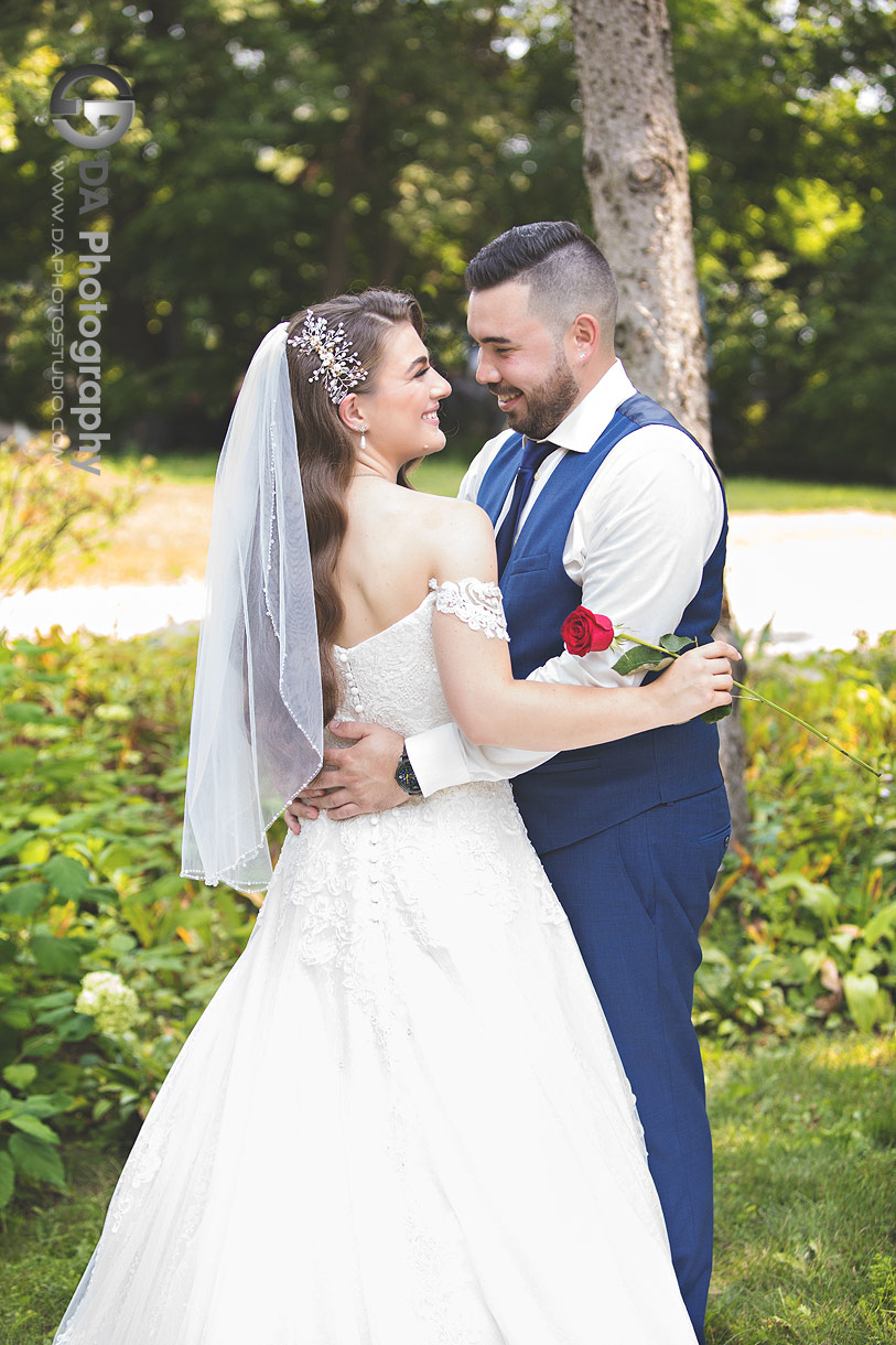 Bride wearing a boho-inspired wedding gown standing under soft natural light at NithRidge Estates in Ayr