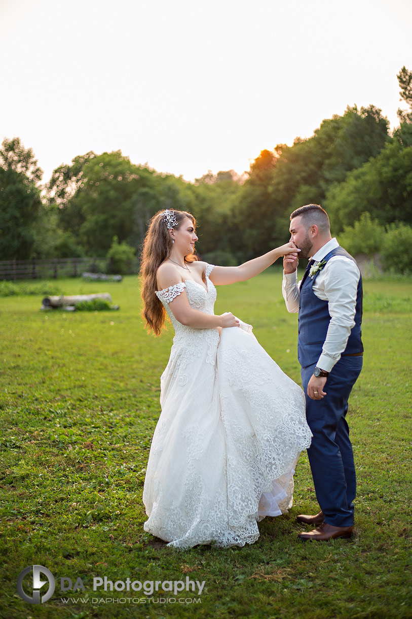  Bride and groom in open field at sunset during their NithRidge wedding