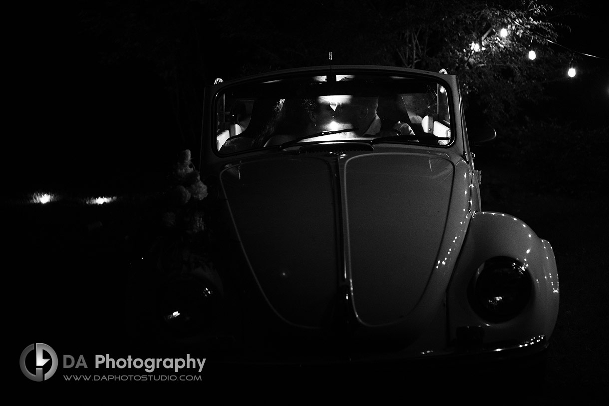 Silhouettes photo of a bride and groom in a car