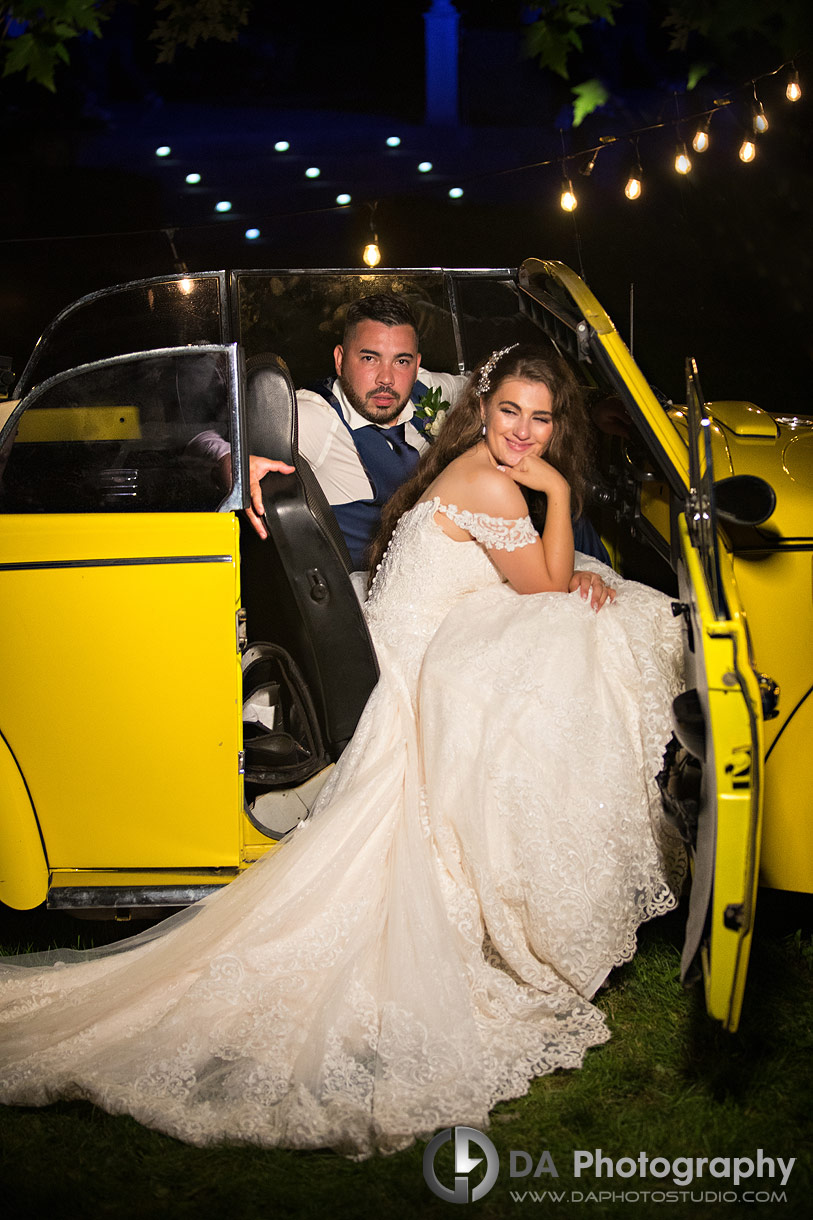 Boho Style Wedding couple in a yellow beetle 