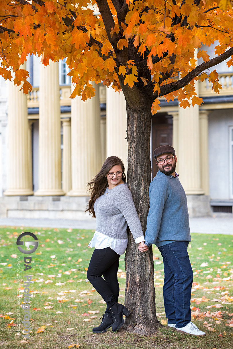 Dundurn Castle engagement photo with historic stone architecture and autumn foliage