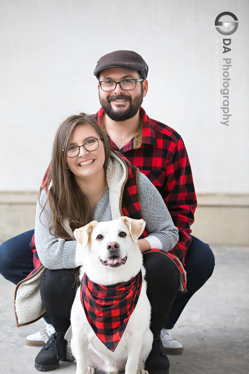 Couple wearing coordinated outfits with their dog on Dundurn Castle terrace