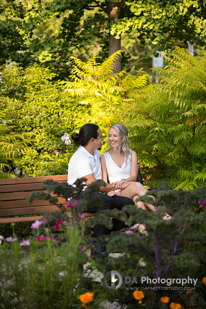 Couple sharing a candid laugh under bright summer light at Westwood Park