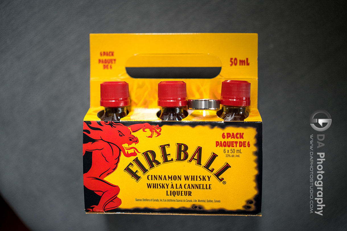 Groom's wedding ring on a fireball cinnamon whiskey box