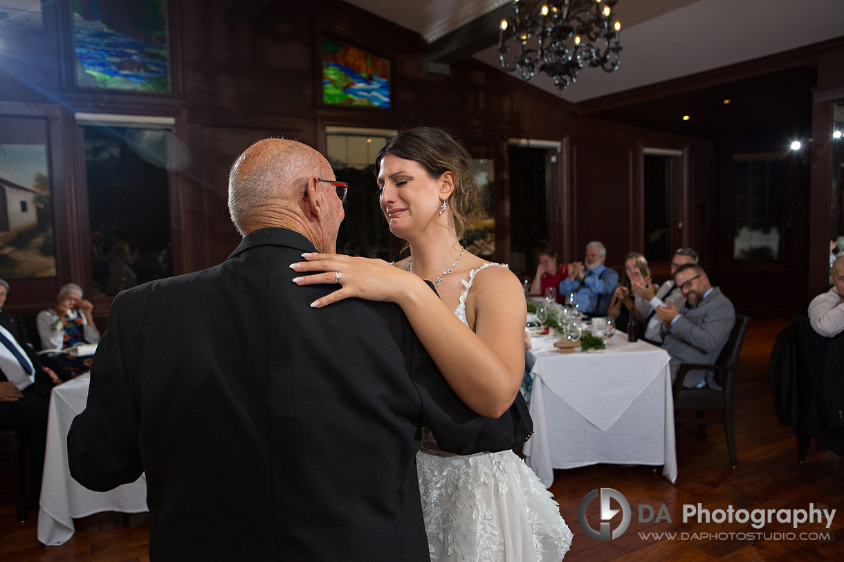 Emotional photo of bride dancing with her grandfather