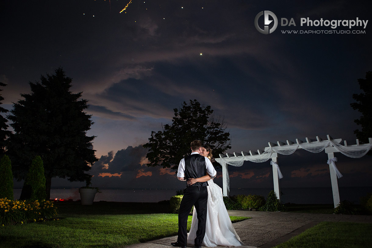 Fireworks by the lake during sunset