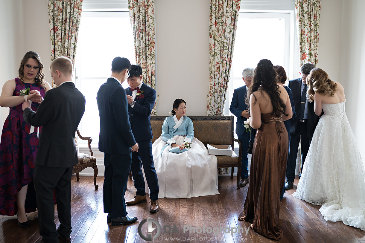 Candid photo of a immediate family group getting ready for formal photos