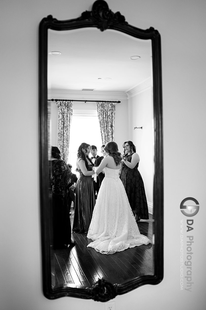 Mirror reflection of wedding party getting ready