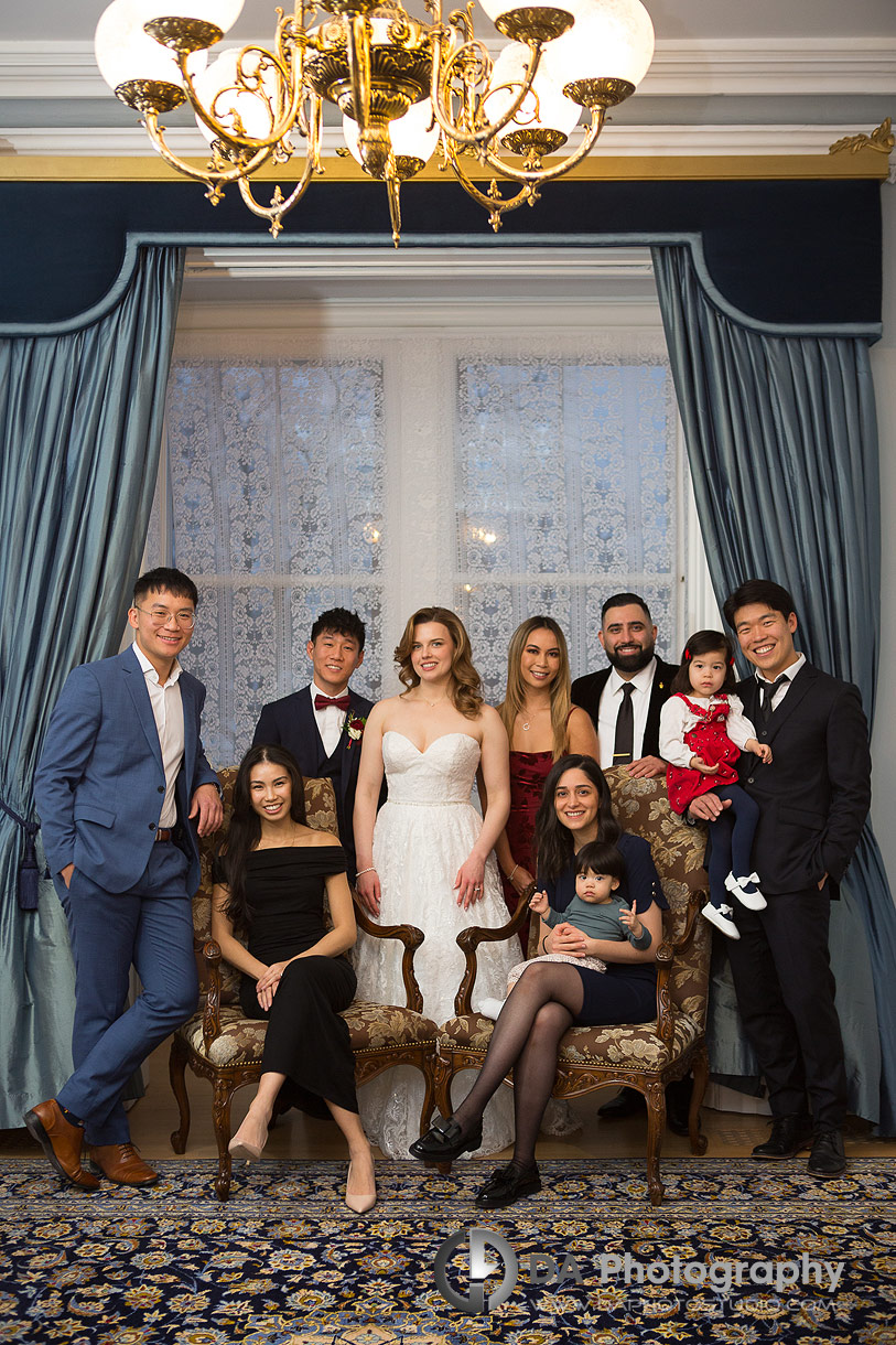 Group photo of a wedding couple friends with their families