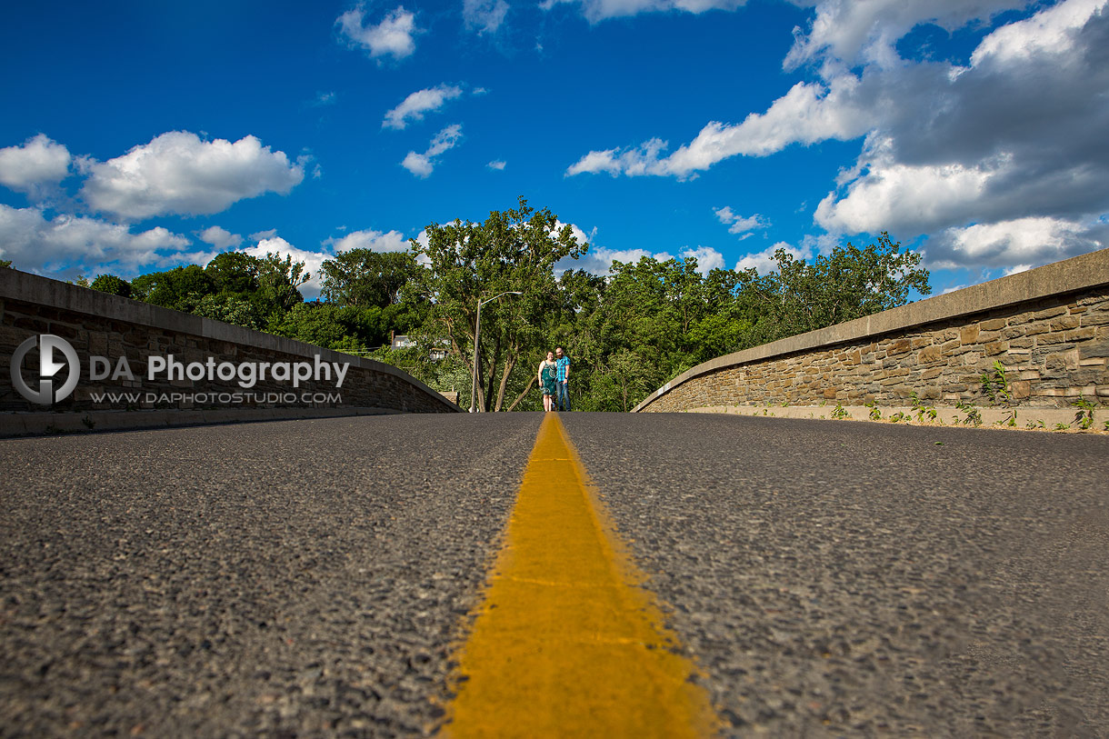 Creative Photo of a Couple with a dog on a bridge