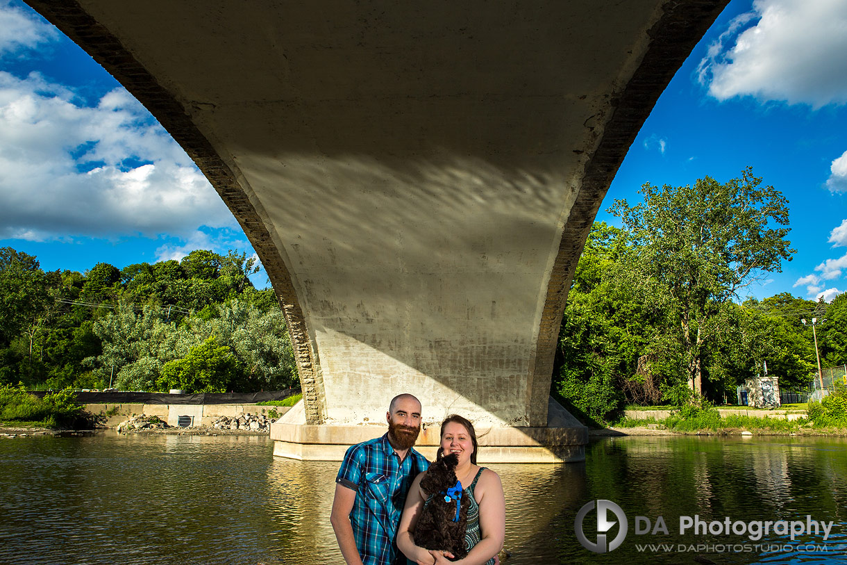 Creative Photo of a Couple with a dog under a bridge