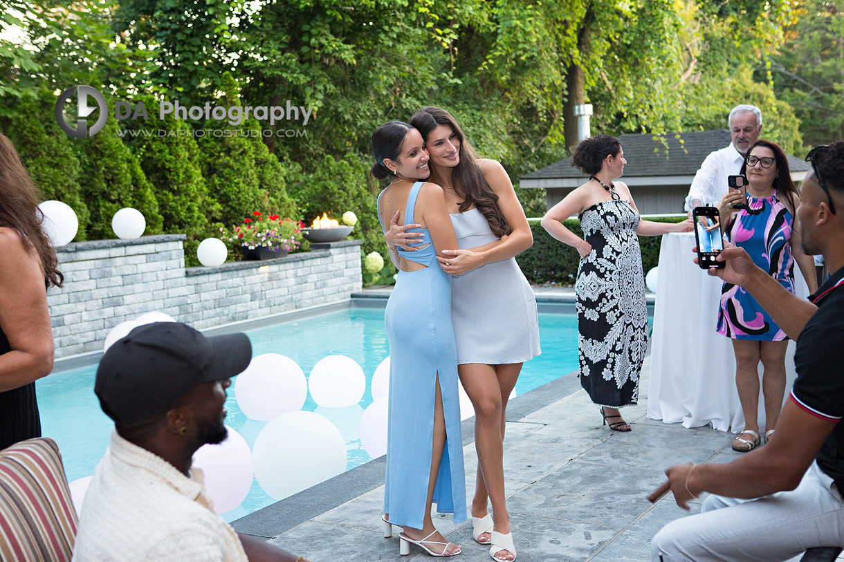 Pictures by the pool of backyard party in Oakville 