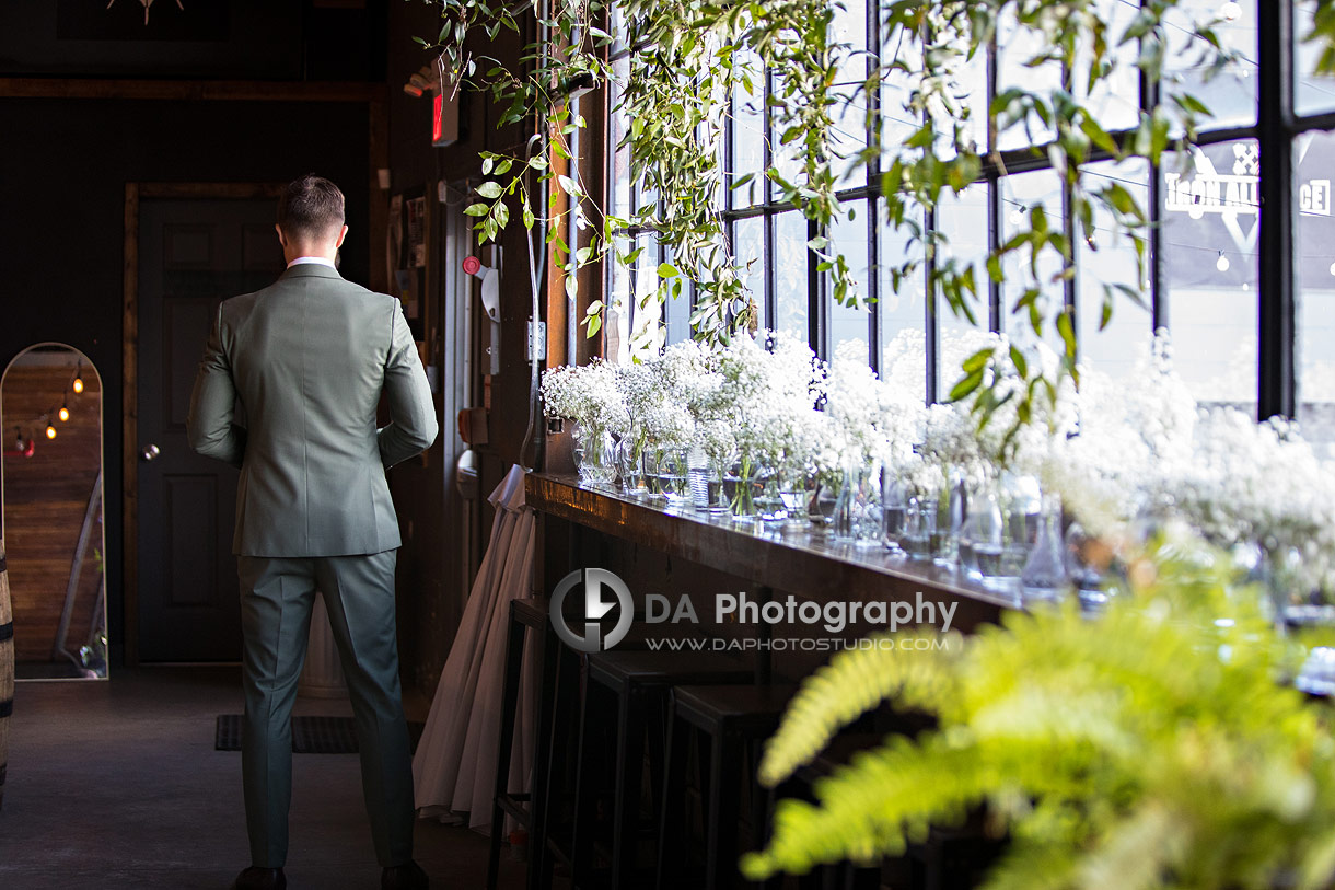 Photo of a Groom waiting for the first look with his bride