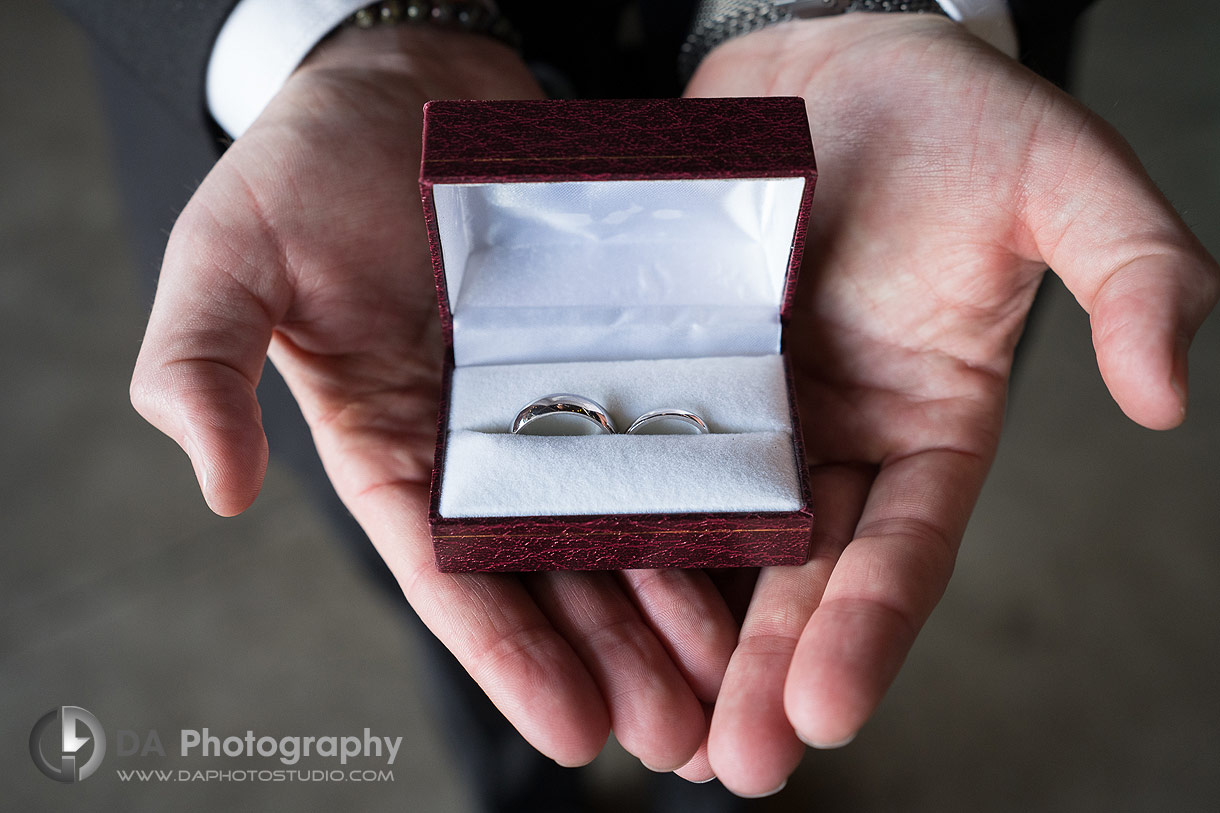 Photo of the best man holding the wedding bands