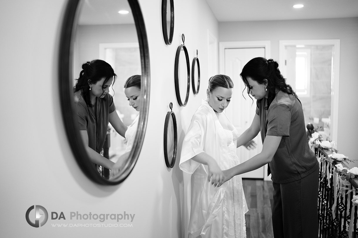 Photo of a bride putting her robe