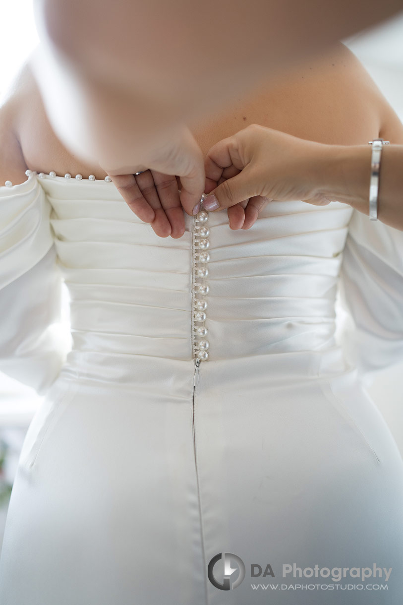 Photo of the back of a wedding dress buttons