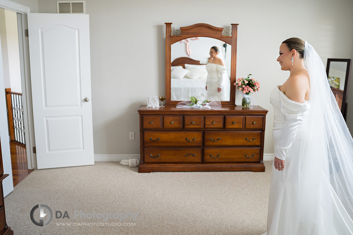 Photo of a bride waiting for her dad for the first look on a wedding day