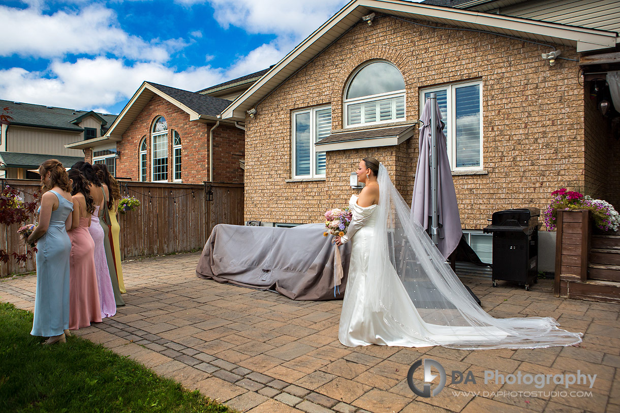 Photo of a bride first look with her bridesmaids