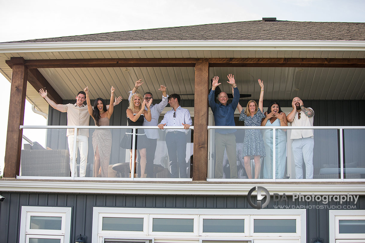 Family hides during a Surprise Proposal in Port Dover by Lake Erie at Sunset
