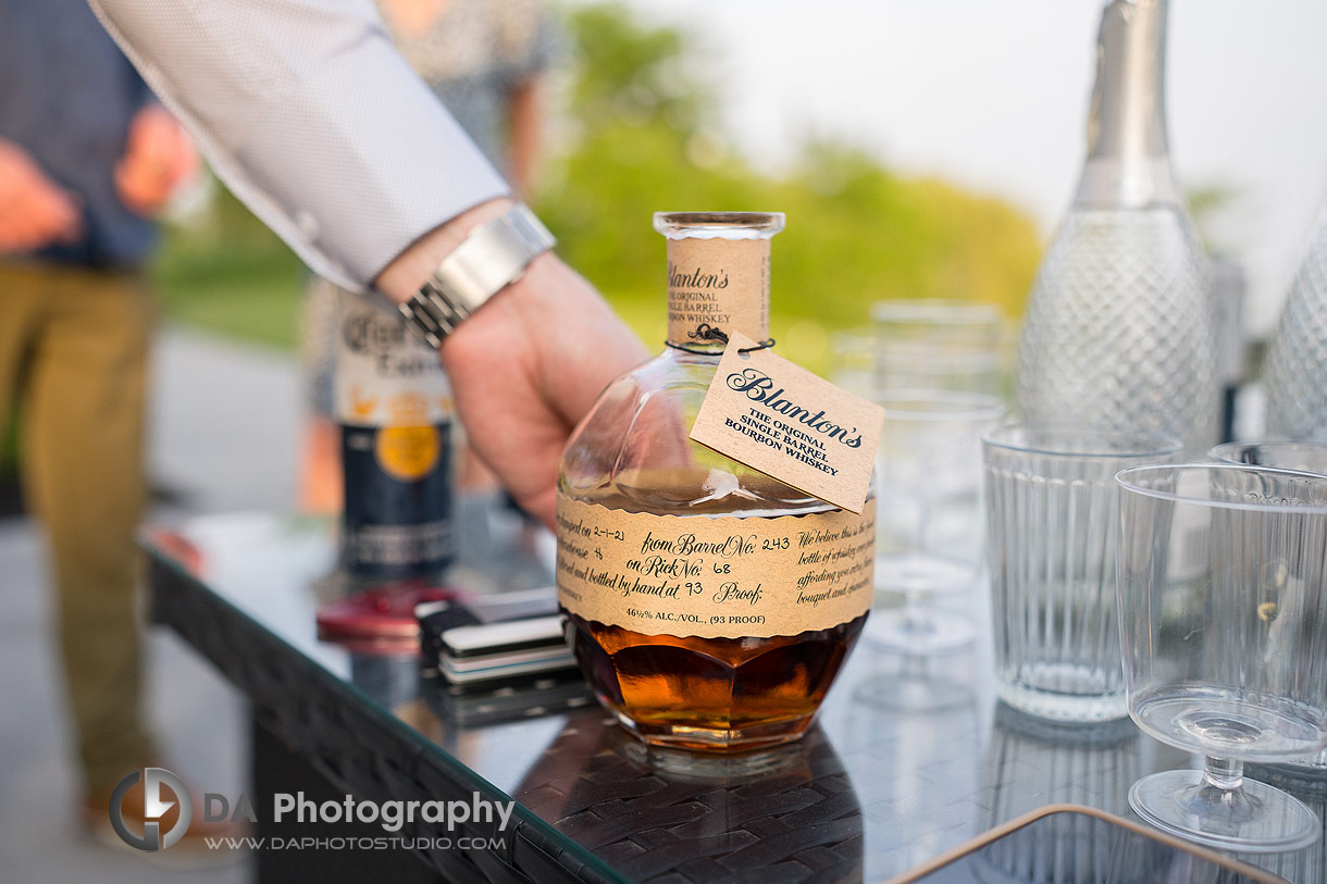 Close up photo of a whiskey bottle in celebration of marriage proposal 